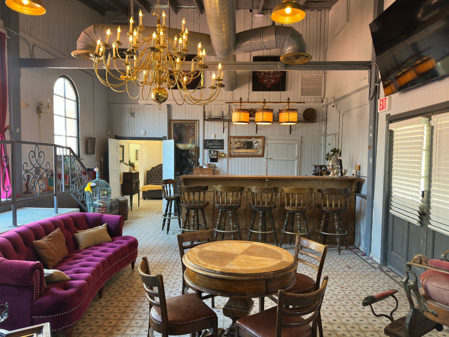 The Library looking toward the bar, beneath the gold chandelier