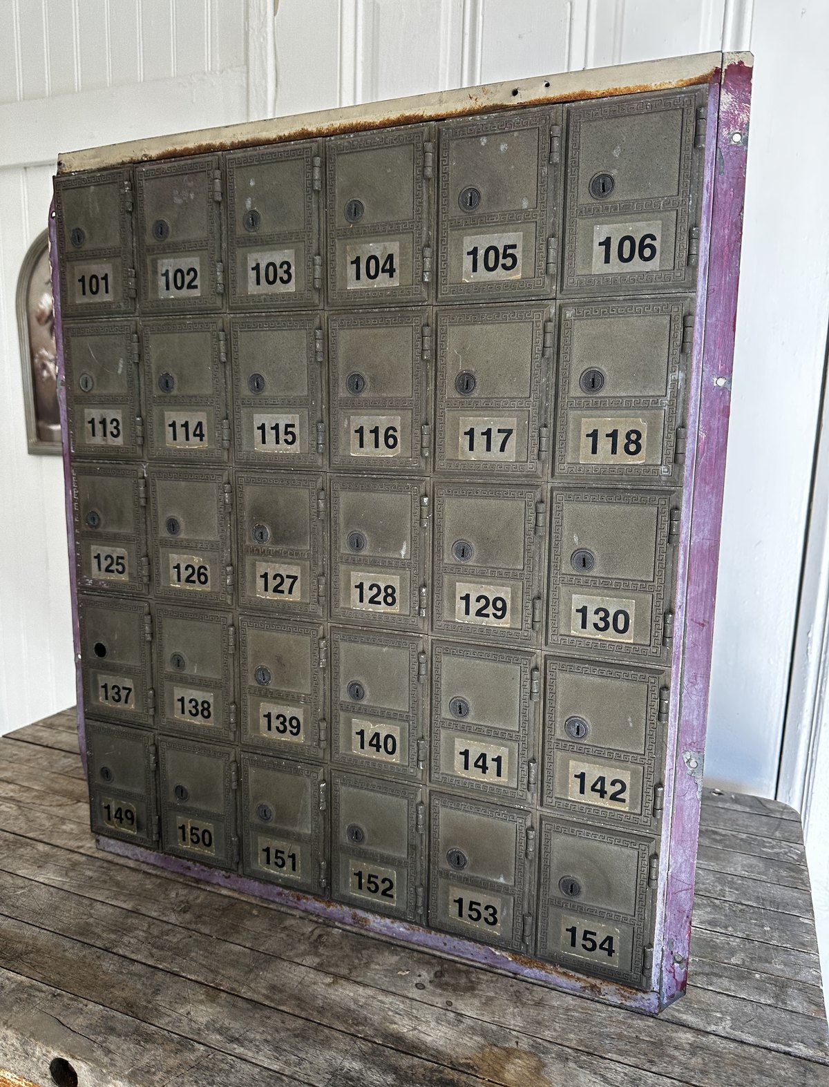 The original antique post office boxes, still numbered, where mail for virtual office members is handled